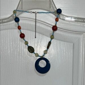 Vibrant Blue and Red Necklace with Circular Pendant